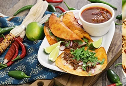 Birria Tacos - Tender, slow-braised beef in rich consommé, folded into crispy corn tortillas with melted cheese and fresh cilantro. Served with a side of savory birria broth for dipping.